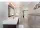 Elegant bathroom with a vanity, large mirror, and a walk-in shower at 15409 Waterline Rd, Bradenton, FL 34212