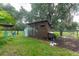 Charming chicken coop nestled in a lush backyard setting at 15409 Waterline Rd, Bradenton, FL 34212