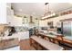 Bright kitchen with white cabinets, a large island, and stainless steel appliances at 15409 Waterline Rd, Bradenton, FL 34212