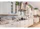 Modern kitchen with white cabinets and granite countertops at 15409 Waterline Rd, Bradenton, FL 34212