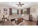 Relaxing living room with sectional sofa, large windows, and wood floors at 15409 Waterline Rd, Bradenton, FL 34212