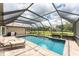 Screened pool with paver deck and backyard view at 15409 Waterline Rd, Bradenton, FL 34212