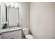 Powder room with single vanity and granite countertop at 16008 Crofton Springs Way, Port Charlotte, FL 33953