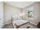 Cozy bedroom with a queen-size bed and large window at 16008 Crofton Springs Way, Port Charlotte, FL 33953