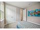 Bright bedroom with double doors and a window at 16008 Crofton Springs Way, Port Charlotte, FL 33953