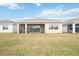 Back exterior view showing screened porch at 16008 Crofton Springs Way, Port Charlotte, FL 33953