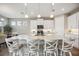 Modern kitchen with white cabinets and granite island at 16008 Crofton Springs Way, Port Charlotte, FL 33953