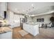 Modern kitchen with white cabinets and center island at 16008 Crofton Springs Way, Port Charlotte, FL 33953