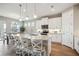 Modern kitchen with white cabinets, granite countertops, and an island at 16008 Crofton Springs Way, Port Charlotte, FL 33953