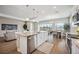 Open concept kitchen and dining area with hardwood floors at 16008 Crofton Springs Way, Port Charlotte, FL 33953