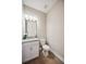 Modern powder room with white vanity and granite countertop at 16008 Crofton Springs Way, Port Charlotte, FL 33953