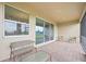 Relaxing screened porch with seating and glass doors at 16008 Crofton Springs Way, Port Charlotte, FL 33953