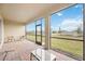 Screened porch with brick floor and outdoor furniture at 16008 Crofton Springs Way, Port Charlotte, FL 33953