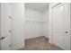 Large walk-in closet with double entry and ample shelving at 16008 Crofton Springs Way, Port Charlotte, FL 33953