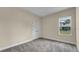 Simple bedroom with carpeted floor, neutral walls, and a closet at 1637 Turrell St, North Port, FL 34286