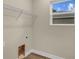 Laundry room with overhead shelving and vinyl flooring at 1637 Turrell St, North Port, FL 34286