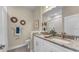 Elegant bathroom featuring double sinks and granite countertops at 1794 Karluk St, North Port, FL 34287