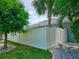 Landscaped backyard with white vinyl fence and gate at 18652 Ohara Dr, Port Charlotte, FL 33948