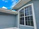 Close-up of exterior wall with arched window at 18652 Ohara Dr, Port Charlotte, FL 33948