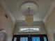 Elegant foyer with chandelier and high ceilings at 18652 Ohara Dr, Port Charlotte, FL 33948