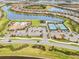 Aerial view of community with pool and tennis courts at 19066 Mangieri St, Venice, FL 34293