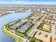 Aerial view of community tennis courts and lake at 19066 Mangieri St, Venice, FL 34293