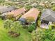 Aerial view of houses with lush landscaping and a community pool at 19066 Mangieri St, Venice, FL 34293