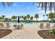 Expansive pool and patio area with lounge chairs and plenty of space for relaxation at 19066 Mangieri St, Venice, FL 34293