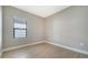 Simple bedroom with wood-look floors and a window at 209 Brindisi Cir, Nokomis, FL 34275