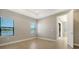 Bright bedroom with wood-look floors and large windows at 209 Brindisi Cir, Nokomis, FL 34275