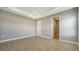 Spacious bedroom with wood-look floors and walk-in closet at 209 Brindisi Cir, Nokomis, FL 34275