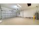 Attached garage with epoxy flooring and opener at 209 Brindisi Cir, Nokomis, FL 34275