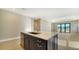 Kitchen island with sink and lake view at 209 Brindisi Cir, Nokomis, FL 34275