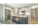 Modern kitchen with white cabinets and island at 209 Brindisi Cir, Nokomis, FL 34275