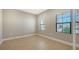 Bright office with neutral walls, wood-look flooring, and two windows at 209 Brindisi Cir, Nokomis, FL 34275