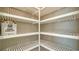 Large pantry with white slatted shelving at 209 Brindisi Cir, Nokomis, FL 34275