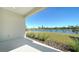 Patio with lake view and grassy area at 209 Brindisi Cir, Nokomis, FL 34275