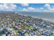 Aerial view of a house near the beach, showcasing the surrounding neighborhood and waterfront at 210 Willow Ave, Anna Maria, FL 34216