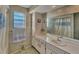 Bathroom with bathtub, shower and single sink vanity at 210 Willow Ave, Anna Maria, FL 34216