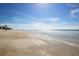 Peaceful beach scene with a person walking at 210 Willow Ave, Anna Maria, FL 34216