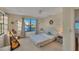 Bright bedroom with large windows and a queen bed at 210 Willow Ave, Anna Maria, FL 34216