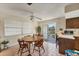 Dining area with round table and chairs near sliding door at 210 Willow Ave, Anna Maria, FL 34216