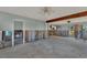 Large living room undergoing a complete renovation, showing exposed beams and walls at 210 Willow Ave, Anna Maria, FL 34216