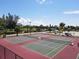 Two well-maintained tennis courts at 210 Willow Ave, Anna Maria, FL 34216