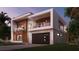 Modern two-story home with wood and white exterior, and a two-car garage at 2135 Hibiscus St, Sarasota, FL 34239