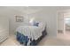 Bedroom with a full-size bed, ceiling fan, and plenty of closet space at 2145 Pueblo Cir # V12, Sarasota, FL 34231