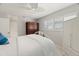 Bedroom with a queen bed, ceiling fan, and built-in wardrobe at 2145 Pueblo Cir # V12, Sarasota, FL 34231