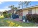 Relaxing patio with seating area, surrounded by lush landscaping at 2145 Pueblo Cir # V12, Sarasota, FL 34231