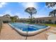 Community swimming pool with patio and lounge chairs at 2145 Pueblo Cir # V12, Sarasota, FL 34231