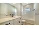 Clean bathroom, white vanity, bathtub, and tile at 221 Brindisi Cir, Nokomis, FL 34275